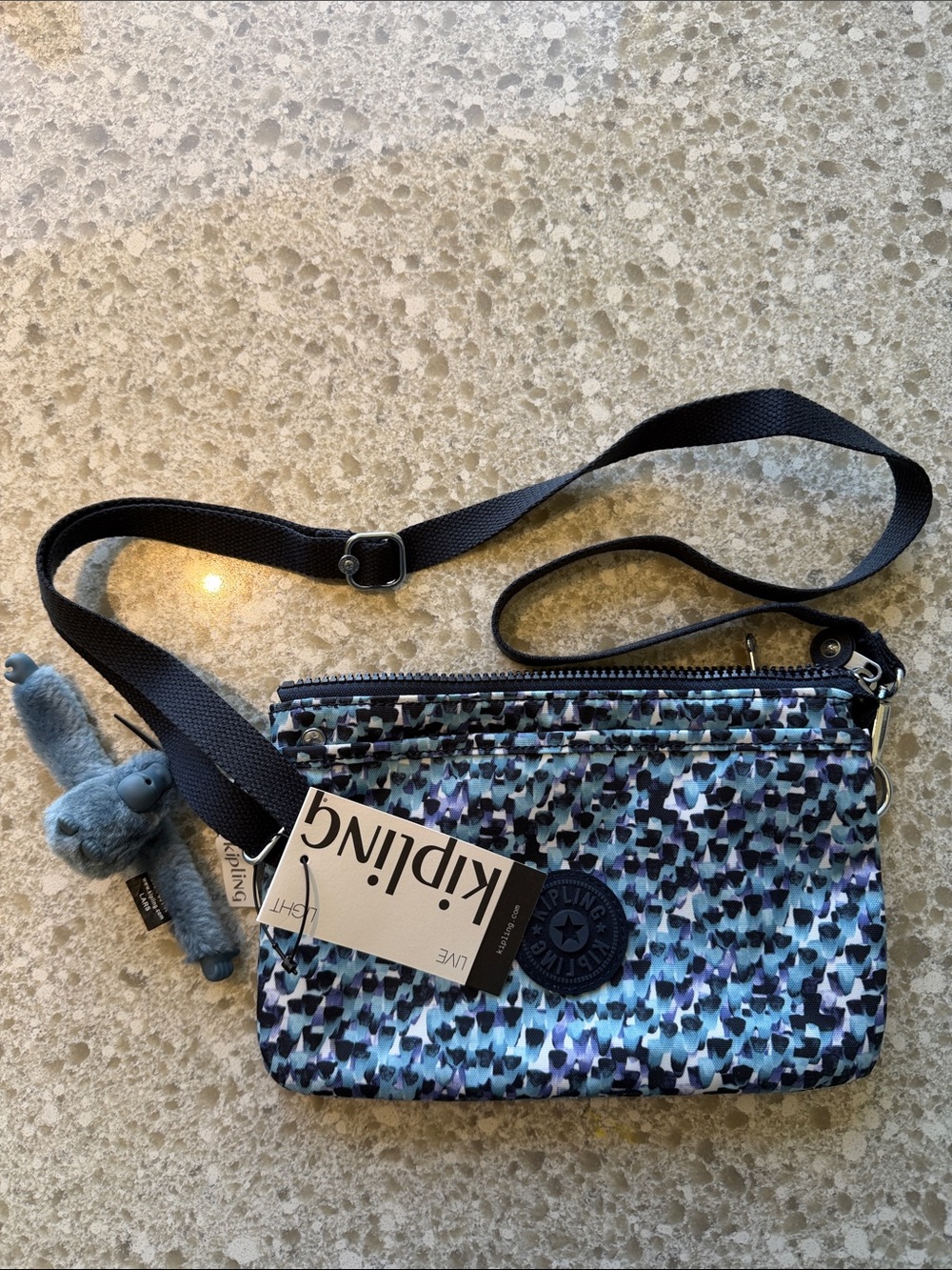 Kipling Blue Multi-Print Crossbody Bag with Plush Monkey Charm